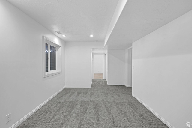 645 N 800 W, Brigham City, UT 84302 - interior space with light colored carpet and a textured ceiling