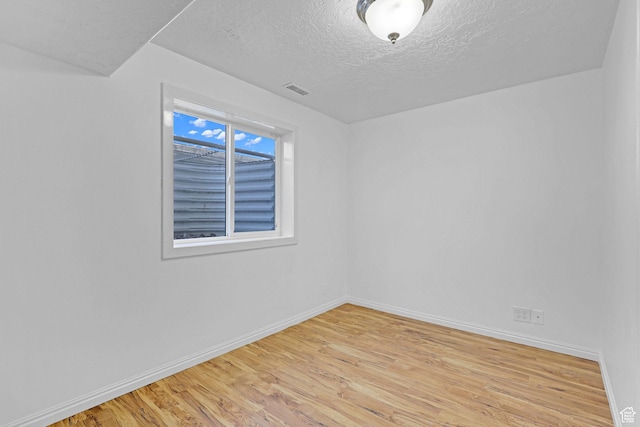 645 N 800 W, Brigham City, UT 84302 - spare room with a textured ceiling and light hardwood / wood-style flooring