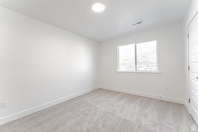 4696 S Alder Dr Unit 214, Mapleton, UT 84664 - carpeted empty room with baseboards and a textured ceiling