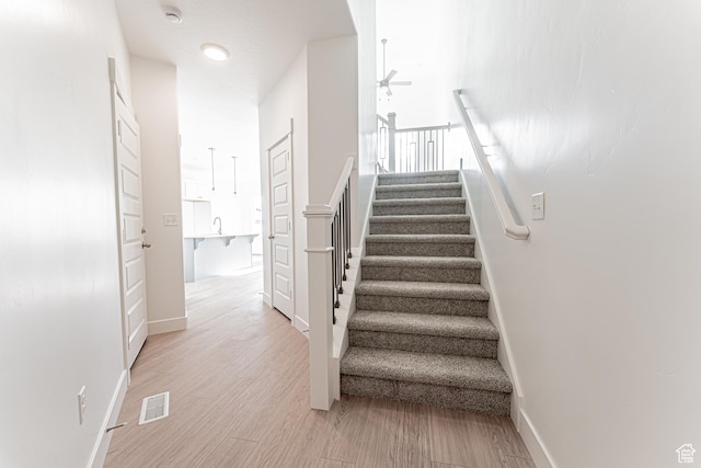 4696 S Alder Dr Unit 214, Mapleton, UT 84664 - stairs featuring ceiling fan, baseboards, and wood finished floors