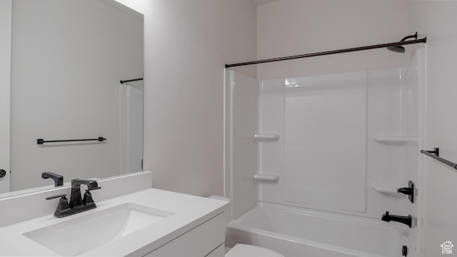 bathroom featuring toilet, vanity, and shower / tub combination