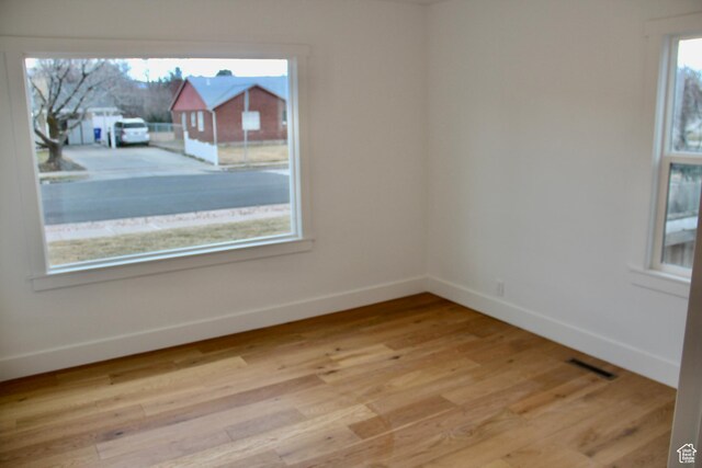 unfurnished dining area with light hardwood / wood-style flooring