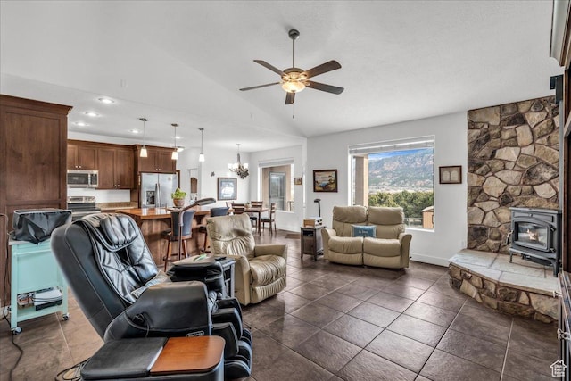 23 S 1200 W, Kanarraville, UT 84742 - living room with ceiling fan with notable chandelier, vaulted ceiling, and a wood stove