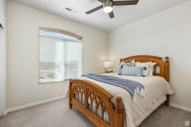 bedroom with carpet floors, baseboards, and a ceiling fan