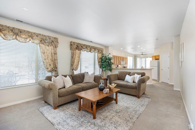 living room with light carpet, baseboards, and recessed lighting