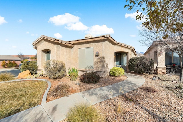 view of front of home featuring stucco siding