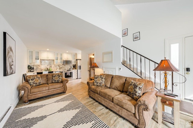 286 W Eagles Roost St Unit D-101, Brian Head, UT 84719 - living room featuring a baseboard radiator and light hardwood / wood-style floors