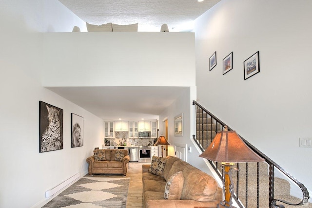 286 W Eagles Roost St Unit D-101, Brian Head, UT 84719 - living room featuring a baseboard heating unit