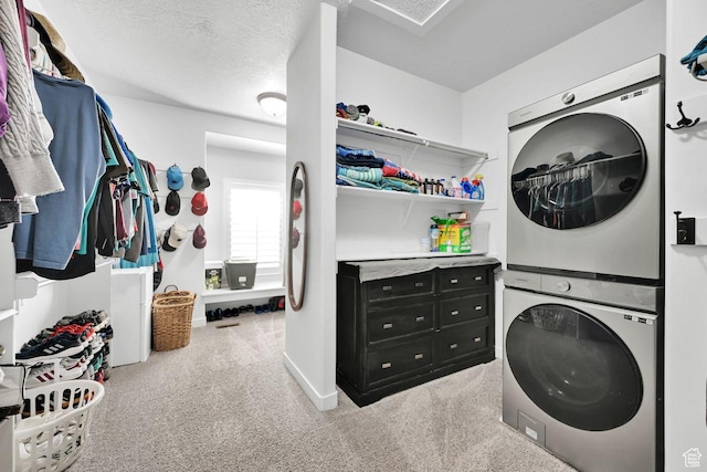 111 S 2300 W, Kaysville, UT 84037 - washroom featuring light colored carpet, laundry area, baseboards, and stacked washer / dryer