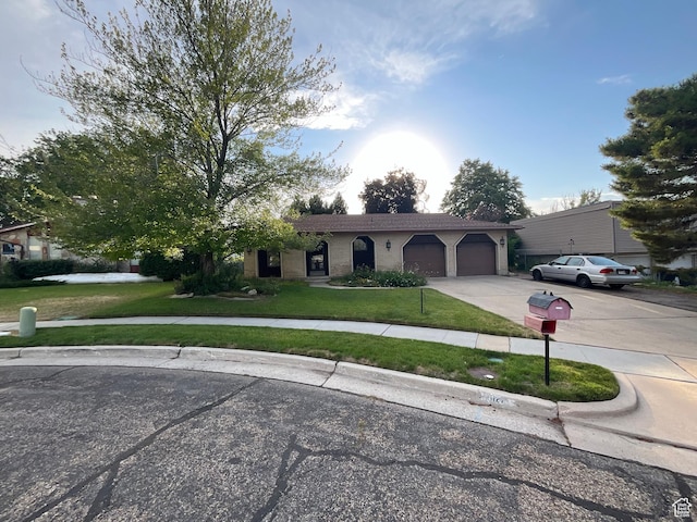 1127 W 4250 S, Riverdale, UT 84405 - ranch-style house featuring an attached garage, a front lawn, driveway, and brick siding