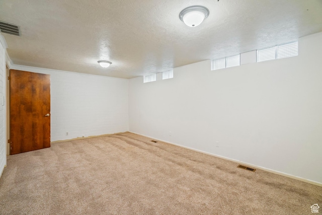1078 Sumac Dr, Logan, UT 84321 - basement with light carpet and a textured ceiling