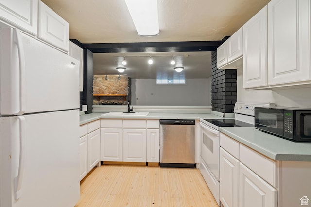 1078 Sumac Dr, Logan, UT 84321 - kitchen featuring sink, light hardwood / wood-style flooring, kitchen peninsula, white appliances, and white cabinets