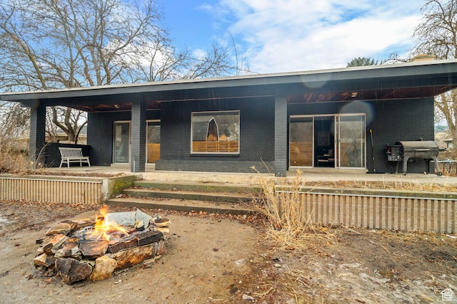 1078 Sumac Dr, Logan, UT 84321 - modern home with an outdoor fire pit