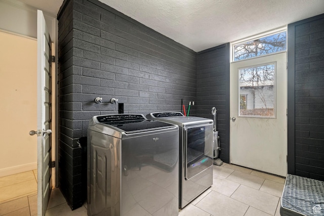 1078 Sumac Dr, Logan, UT 84321 - laundry area with separate washer and dryer, a textured ceiling, and light tile patterned flooring