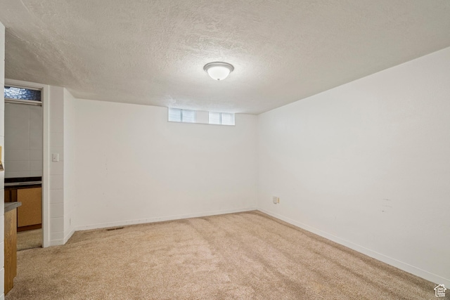 1078 Sumac Dr, Logan, UT 84321 - basement with light carpet and a textured ceiling