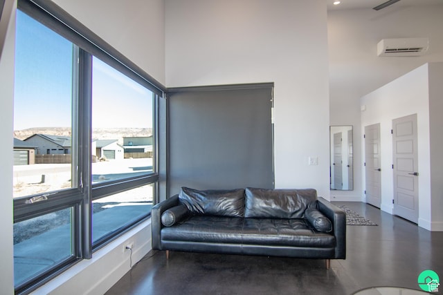 145 Crimson Cliffs Dr, Moab, UT 84532 - living room featuring a towering ceiling and a wall unit AC