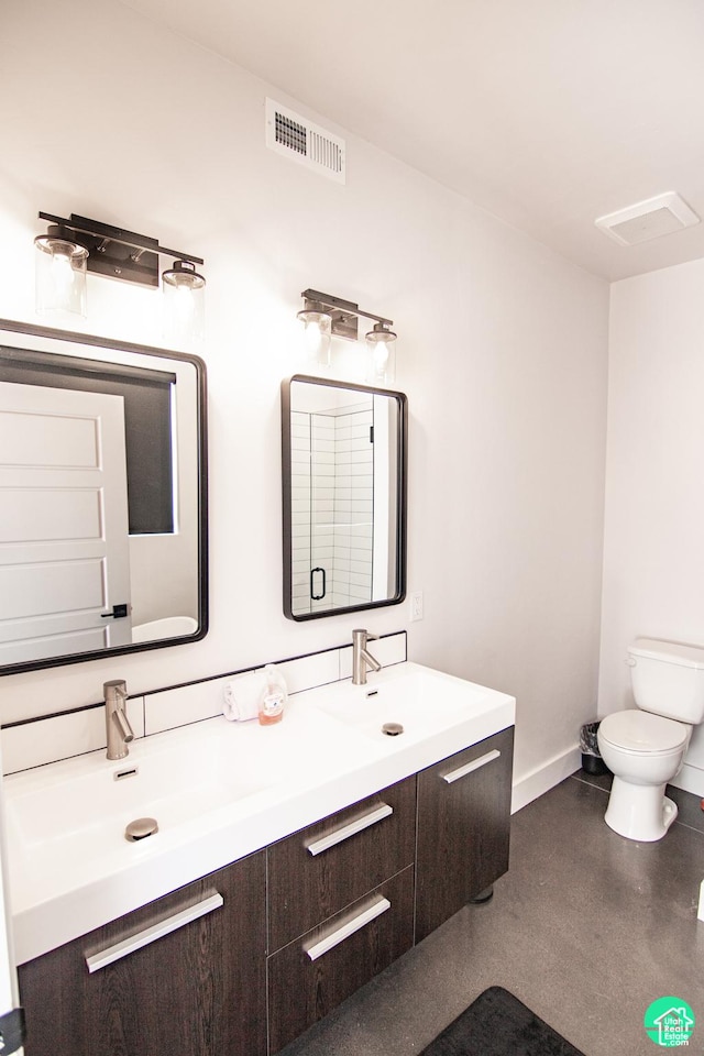 145 Crimson Cliffs Dr, Moab, UT 84532 - bathroom with vanity, concrete floors, and toilet