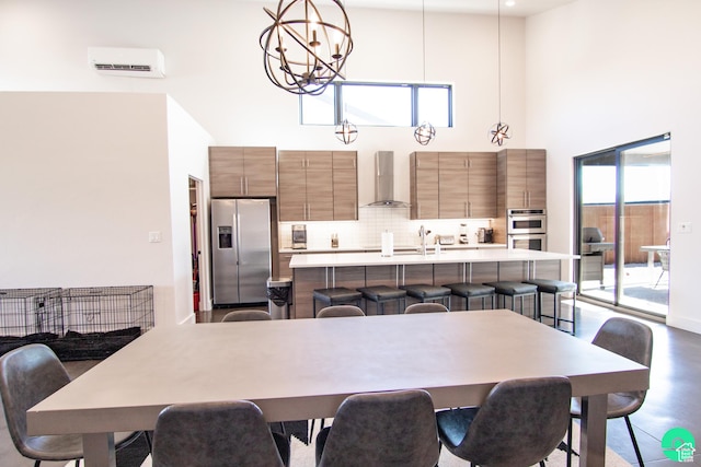 145 Crimson Cliffs Dr, Moab, UT 84532 - dining area featuring a towering ceiling, sink, concrete floors, and a notable chandelier