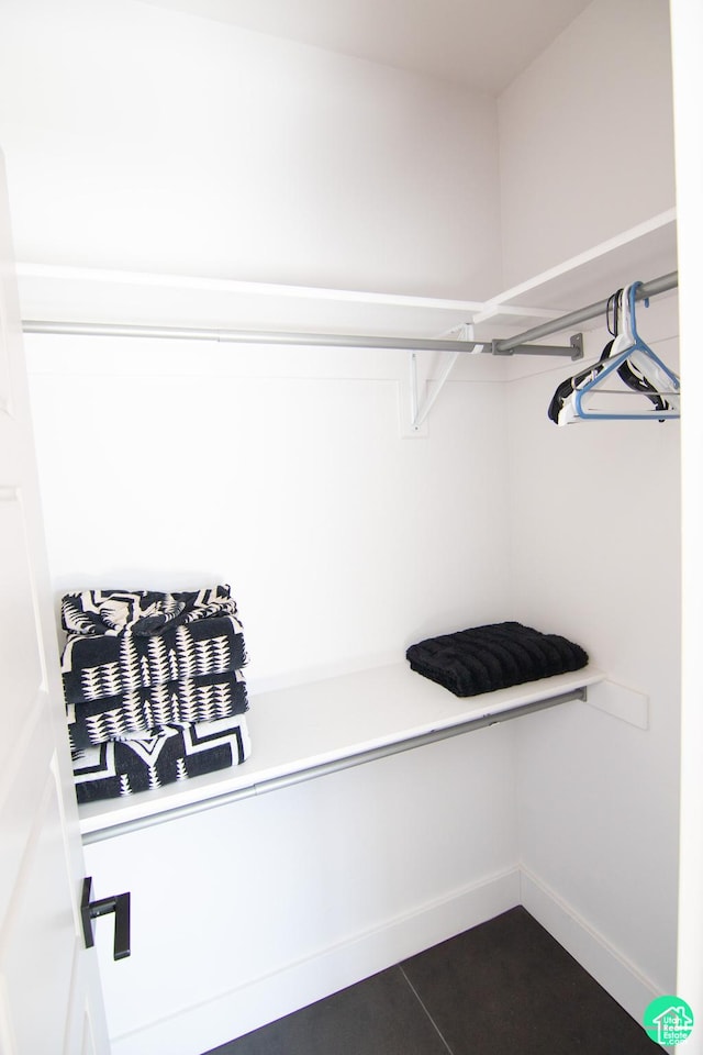 145 Crimson Cliffs Dr, Moab, UT 84532 - spacious closet featuring dark tile patterned floors