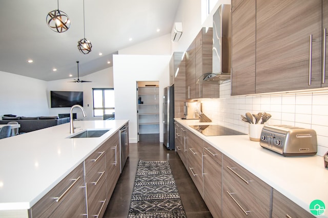 145 Crimson Cliffs Dr, Moab, UT 84532 - kitchen featuring sink, appliances with stainless steel finishes, pendant lighting, decorative backsplash, and wall chimney range hood