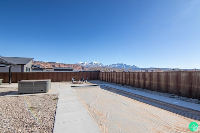 145 Crimson Cliffs Dr, Moab, UT 84532 - view of patio / terrace with a mountain view and a hot tub