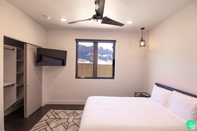 145 Crimson Cliffs Dr, Moab, UT 84532 - bedroom with ceiling fan and dark hardwood / wood-style flooring