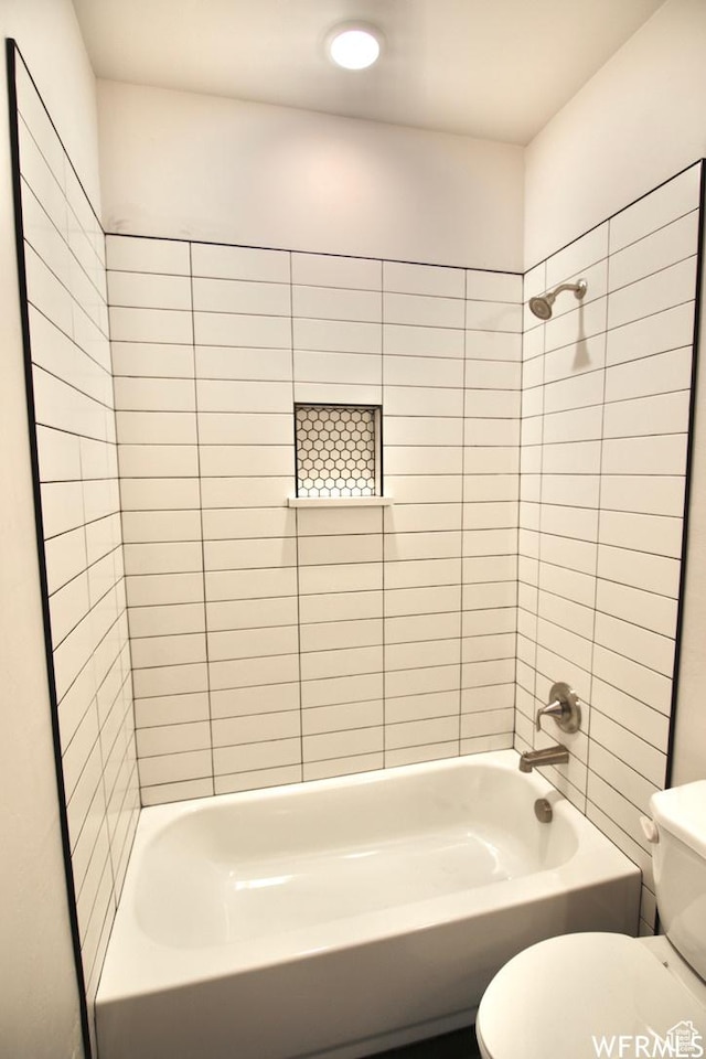 145 Crimson Cliffs Dr, Moab, UT 84532 - bathroom with toilet and tiled shower / bath