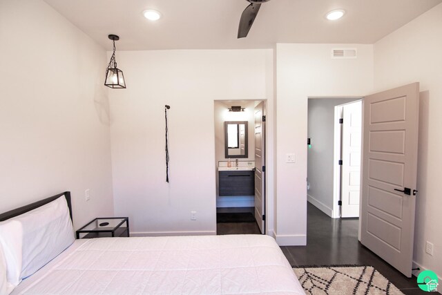 145 Crimson Cliffs Dr, Moab, UT 84532 - bedroom featuring dark hardwood / wood-style flooring and ensuite bathroom