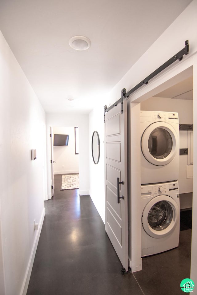 145 Crimson Cliffs Dr, Moab, UT 84532 - laundry area with a barn door and stacked washing maching and dryer