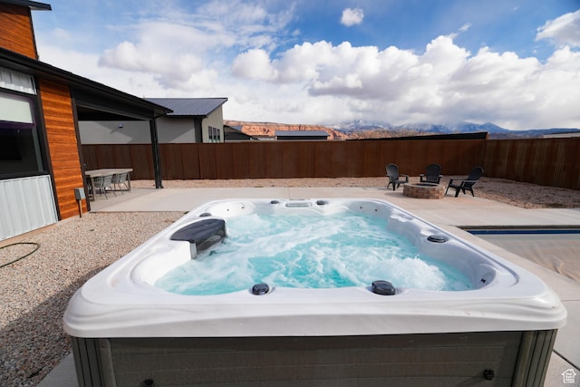 145 Crimson Cliffs Dr, Moab, UT 84532 - view of pool featuring a hot tub, a patio, and an outdoor fire pit