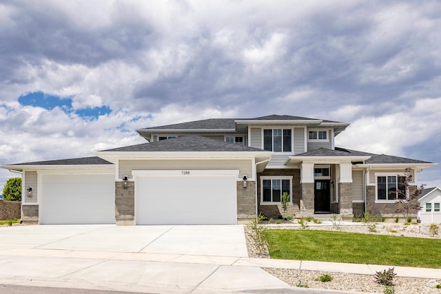 7288 W Hall Crossing Dr S, Herriman, UT 84096 - prairie-style home with a garage, concrete driveway, stone siding, and a front lawn