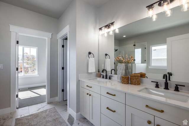 7288 W Hall Crossing Dr S, Herriman, UT 84096 - full bathroom featuring double vanity, healthy amount of natural light, a stall shower, and marble look tile flooring