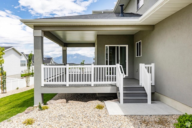 7288 W Hall Crossing Dr S, Herriman, UT 84096 - entrance to property featuring stucco siding and a deck with mountain view
