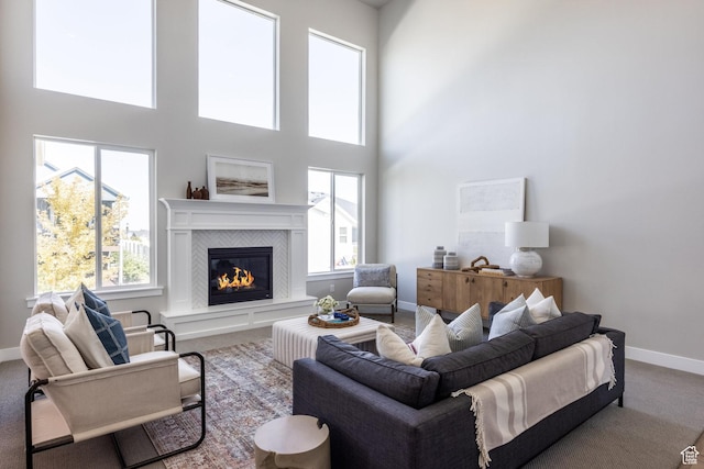 7288 W Hall Crossing Dr S, Herriman, UT 84096 - living room with carpet flooring, a tile fireplace, and a high ceiling