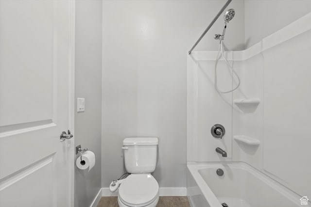 full bath featuring baseboards, toilet, and shower / bath combination