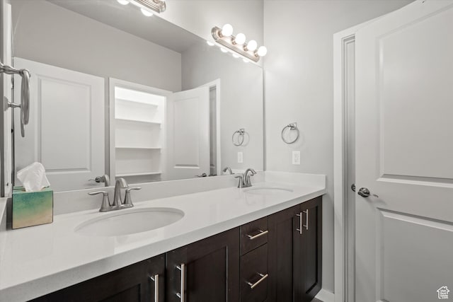 bathroom with double vanity and a sink