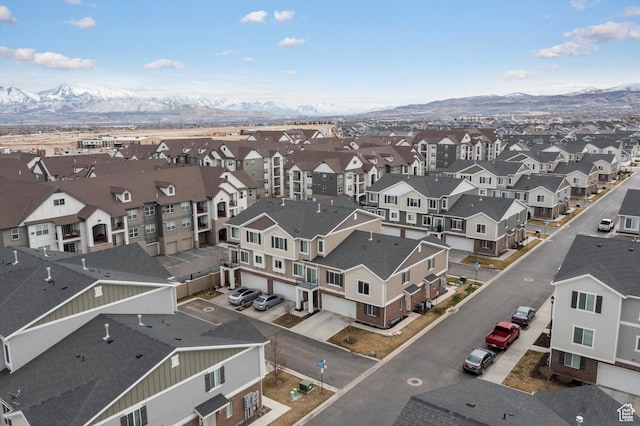 birds eye view of property with a residential view and a mountain view