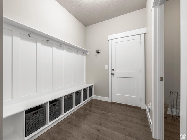 1352 E Abigail Ln, Eagle Mountain, UT 84005 - mudroom featuring dark hardwood / wood-style floors and a textured ceiling