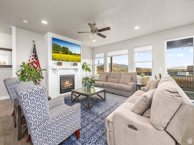 1352 E Abigail Ln, Eagle Mountain, UT 84005 - living room with hardwood / wood-style flooring, ceiling fan, and a fireplace