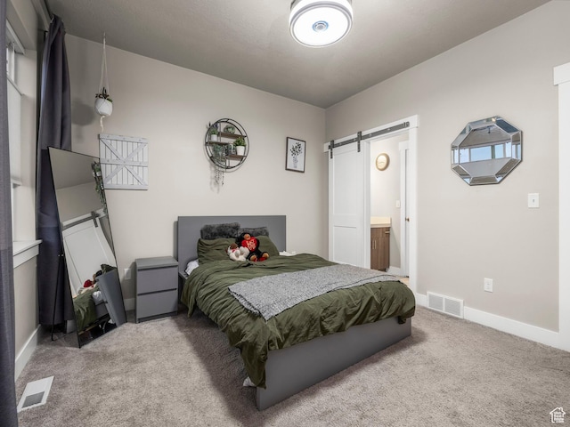 1352 E Abigail Ln, Eagle Mountain, UT 84005 - carpeted bedroom featuring ensuite bathroom and a barn door
