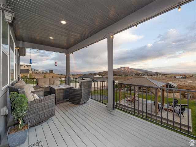 1352 E Abigail Ln, Eagle Mountain, UT 84005 - deck with an outdoor living space and a mountain view