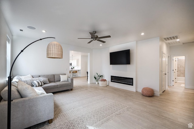 651 W Owen Dr, St George, UT 84790 - living room featuring ceiling fan and light hardwood / wood-style flooring