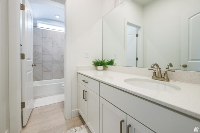 651 W Owen Dr, St George, UT 84790 - full bathroom with wood-type flooring, vanity, tiled shower / bath combo, and toilet