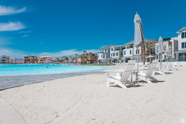 651 W Owen Dr, St George, UT 84790 - view of swimming pool featuring a water view and a beach view