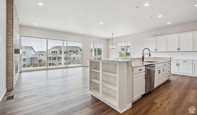 6187 W Wapiti Ridge Ln Unit 334, Herriman, UT 84096 - kitchen featuring white cabinetry, sink, pendant lighting, and a kitchen island with sink