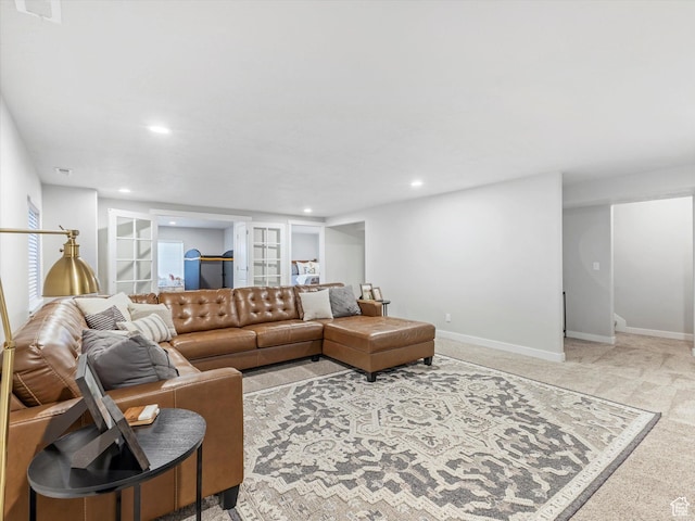 carpeted living room featuring built in features