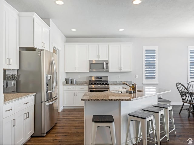 kitchen featuring white cabinetry, stainless steel appliances, and sink