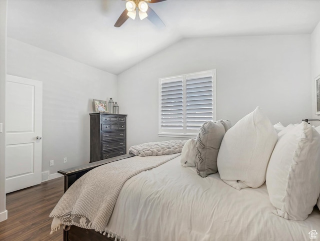 bedroom featuring ceiling fan, lofted ceiling, and dark hardwood / wood-style flooring