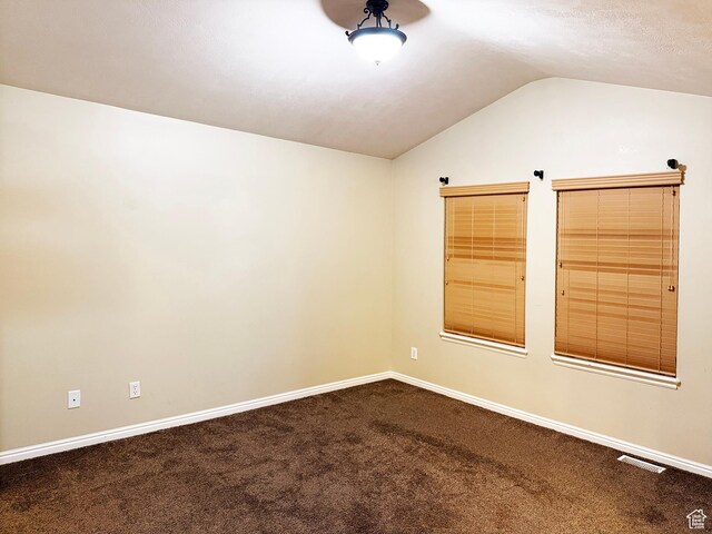 127 E Chandlerpoint Way S, Draper, UT 84020 - empty room featuring visible vents, dark carpet, baseboards, and lofted ceiling