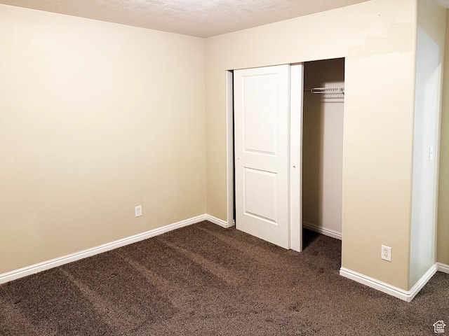 127 E Chandlerpoint Way S, Draper, UT 84020 - unfurnished bedroom with dark colored carpet, a closet, and baseboards
